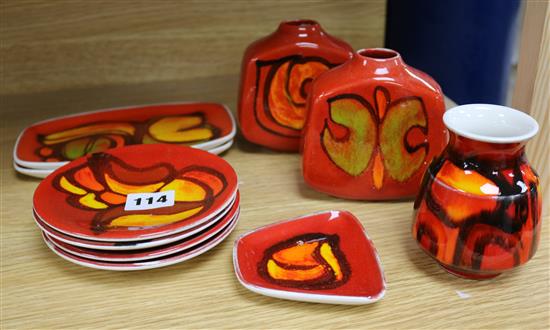 Three Poole Pottery red ground small vases and seven dishes, (10).